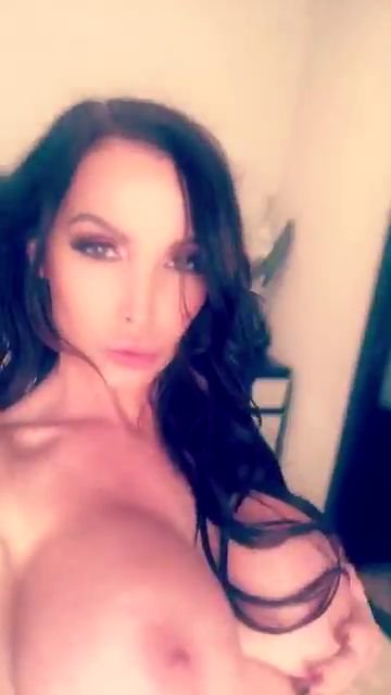 porn star nikki benz with brunette hair taking a snap of her huge tits and nipples